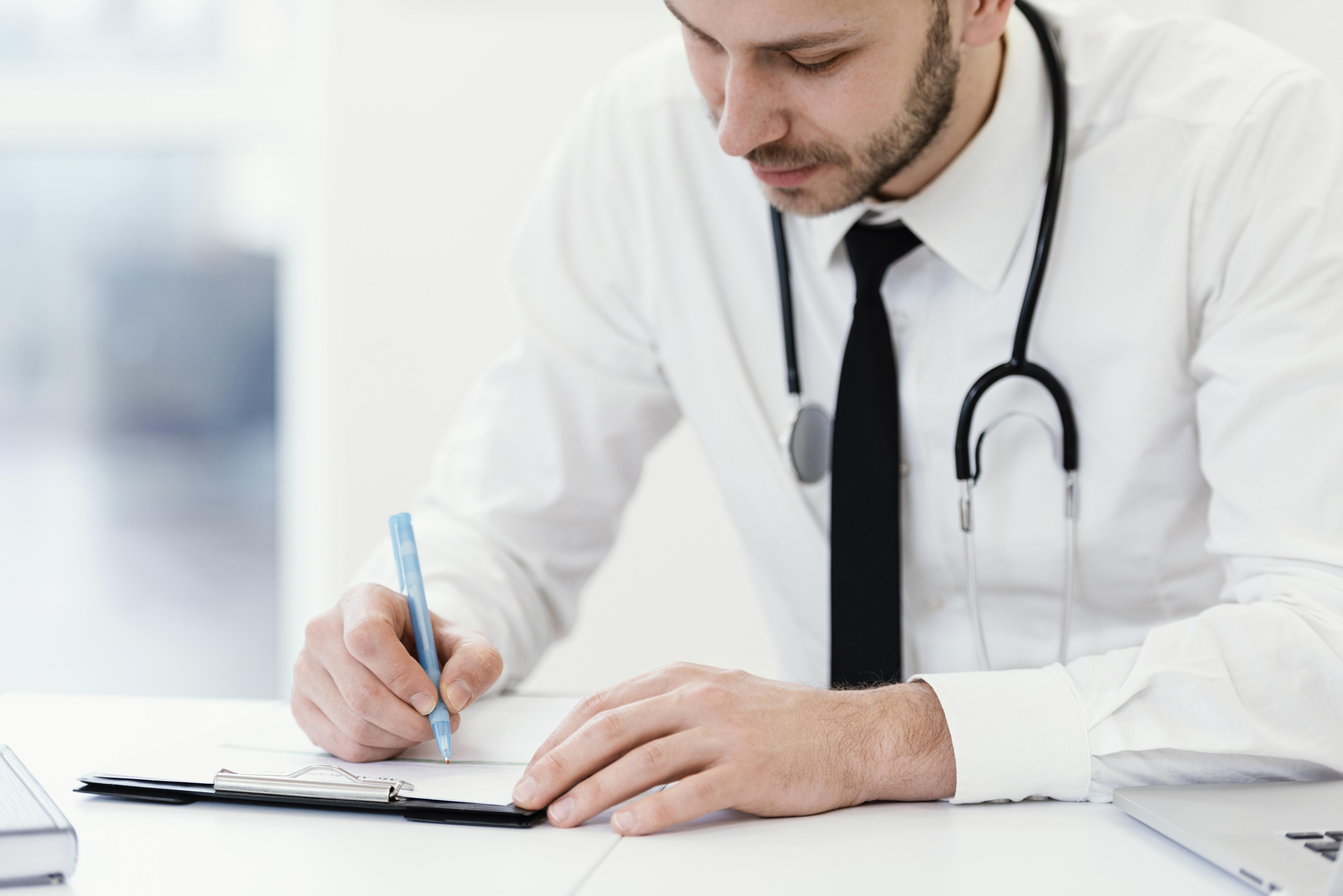 Clinician writing notes